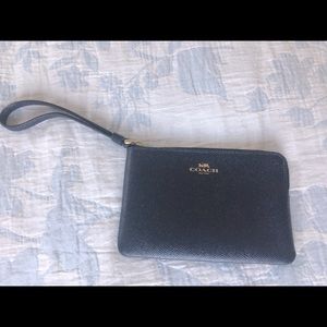Coach corner zip wristlet in signature leather.